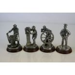 A collection of four English Miniatures metal figures to include a Wheelwright and a cooper.