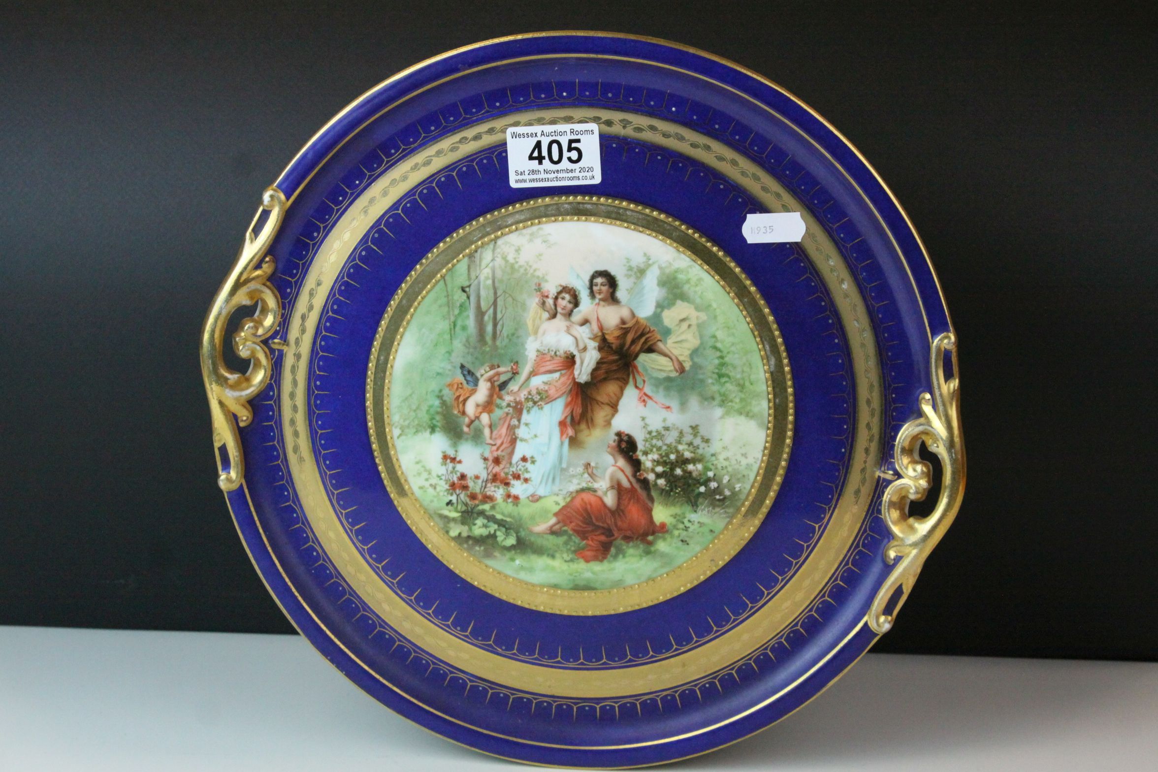 Vienna Style Twin Handled Cabinet Plate, comprising a central panel depicting figures and fairies in