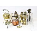 Four vintage paraffin lamp bases together with a group of metalware to include spirit kettle.