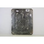 White Metal Plaque with repousse decoration of a Crest, tests as silver