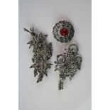 A collection of three vintage marcasite brooches to include a silver example.