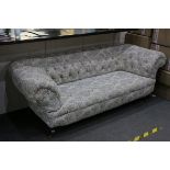 Victorian Chesterfield Drop-end Sofa, button back reupholstered, raised on turned wooden legs with