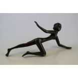 A Art Deco bronze in the form of a nude woman.