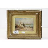 A gilt framed oil on board painting figures on a beach looking out to sea. 10 x 14 cm.