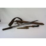 A vintage Indonesian Dayak Sword / Knife with leather sheath together with a small knife with