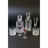 A boxed set of crystal wine glasses quantity of other glasses and two decanters.