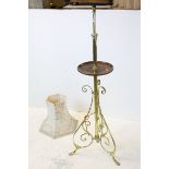1930's Brass Standard Lamp with wooden wine shelf and raised on three scrolling supports, 135cms