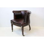 Mid 19th century Tub Chair, upholstered in Oxblood Red Leather with Brass Studding, raised on turned