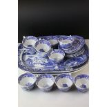 Eleven Italian Spode cups ,seven saucers a side plate together with two willow pattern meat plates.