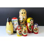 A group of Russian style graduated wooden dolls and others.