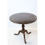 Georgian Mahogany Snap Top Circular Table, raised on a turned column support with three splay