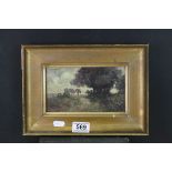 An antique gilt framed watercolour of a rural scene with trees indistinctly signed.121 x 20 cm.