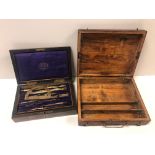 A vintage wooden cased brass drawing instrument set together with a wooden boxed artists pallet.