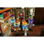 Five Murano glass clown figures.