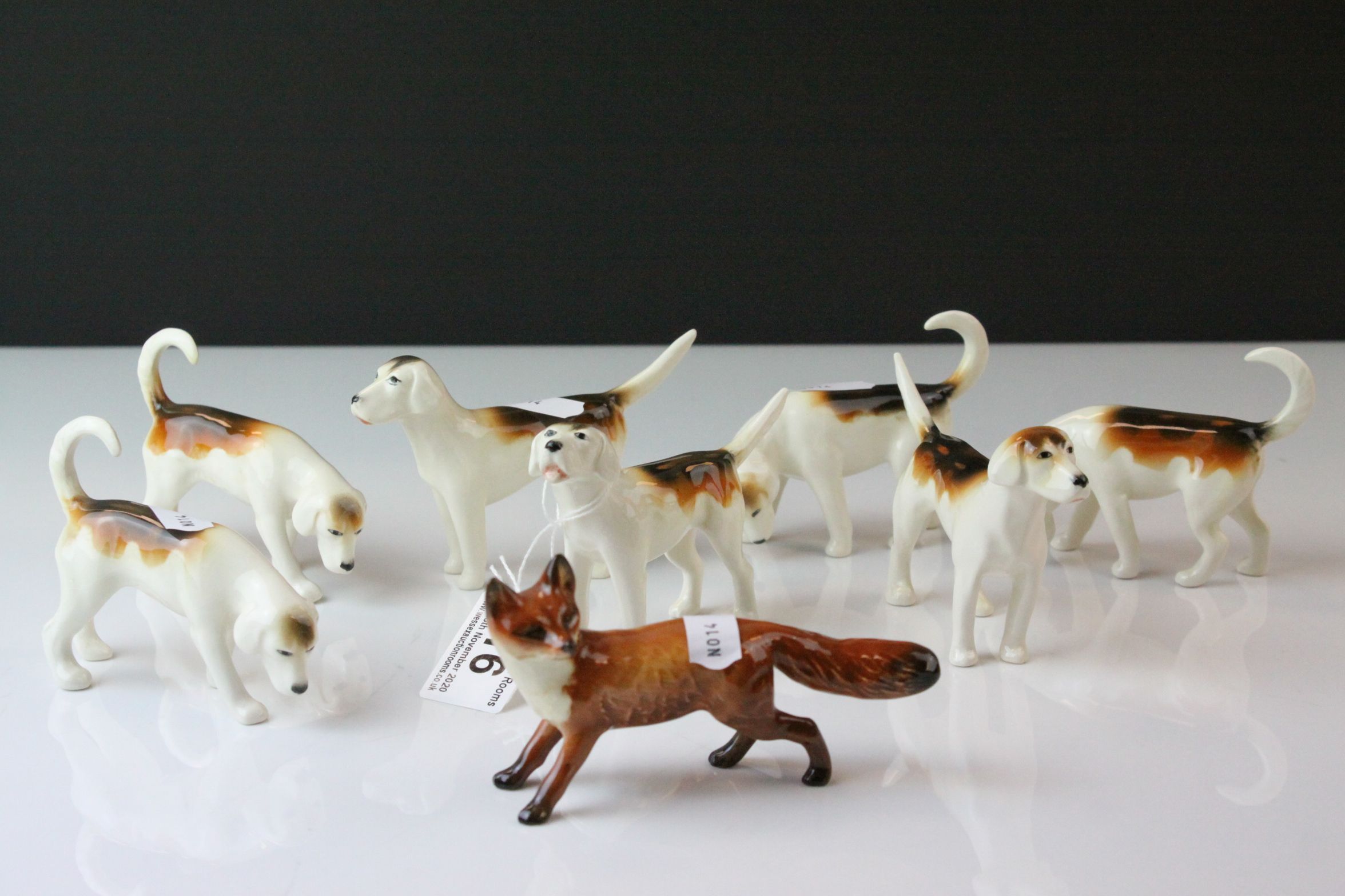 Beswick Fox model 1440 and Seven Beswick Fox Hounds including one model 941, two model 942, two