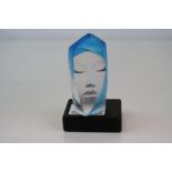 A Matt Johansson Art Glass sculpture in the form of a woman's face.