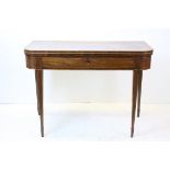 Early 19th century Mahogany String Inlaid Fold-over Tea Table, raised on square tapering legs,