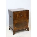 Georgian Mahogany Campaign Commode, the inlaid hinged top opening to reveal a commode with wooden