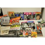 A quantity of Beatles ephemera and items to include press cuttings, books etc.