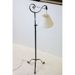 Wrought Iron Standard Lamp together with a Shaped Mahogany Framed Mirror with bevelled edge, 79cms x