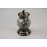 A fully hallmarked sterling silver mounted cut glass pepper grinder.