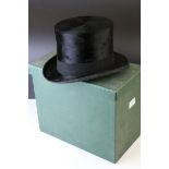 A Dunn and Co silk top hat and carrying box.