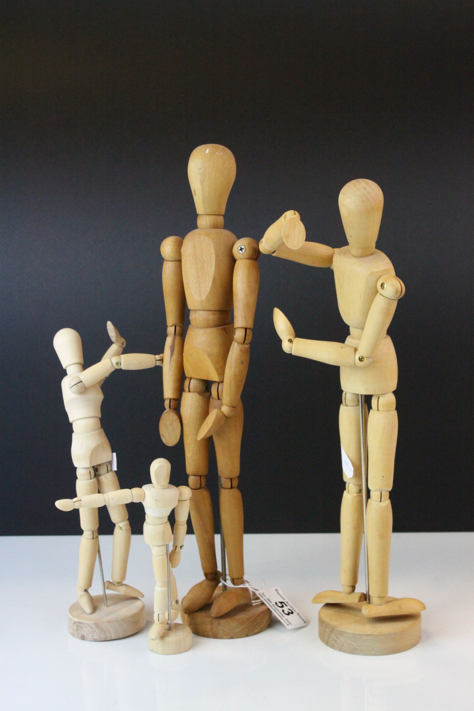 Four Wooden Articulated Artist's Dummy Figures, largest 33cms high