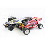 A Tamiya 58087 4WD Manta Ray electric remote control car with transmitter together with a Tamiya