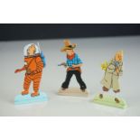 Three contemporary free standing metal Tintin figures, 2.5" approx