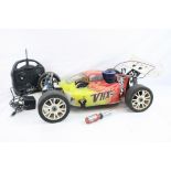 A VRX Racing VRX-2 Nitro 1/8 scale remote control car together with Dash Saber X Transmitter and