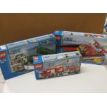 Three boxed Lego City sets to include 7239 Fire Truck, 7244 Speed Boat and 7998 Heavy Hauler. All