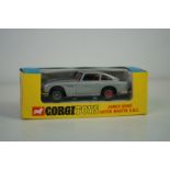 Boxed Corgi 270 James Bond 007 Aston Martin DB5 diecast model in blue/yellow box window, appearing