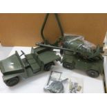 Two original Palitoy Action Man vehicles to include Army Landrover and 105mm Light Gun, with