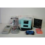 Boxed Nintendo DS Lite console, complete with stylus and charger, plus four other handheld consoles