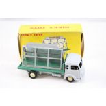 Boxed Dinky French 579 33C Miroitier Simca "Cargo" diecast model with grey cab, green flatbed, cream