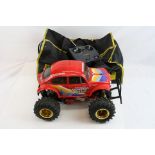 A Tamiya vintage Hump Backed Monster Beetle 2WD Electric remote control car together with an Acoms