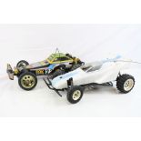 A Tamiya 58051 Fox 1/10 scale electric remote control car together with a Tamiya Grasshopper chassis