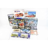 12 x Boxed, unbuilt , plastic model kits to include Airfix 02406 1:32 scale Aston Martin DB5,