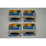 Three carded Husky Batman Batmobile diecast models (bubbles sealed, cards tatty) plus another with