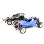 A Tamiya 2WD The Hornet electric remote control buggy together with a Tamiya 2WD Bear Hawk