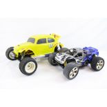 A Schumacher Rascal 1/16 Nitro 2WD remote control car together with a Thunder Tiger DT10 VW Beetle