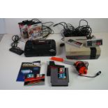 Retro Gaming - Sega Master System II with control pad, cables and three boxed games to include Sonic