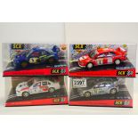 Four cased SCX Scalextric slot cars to include 60000 Mitsubishi Lancer Costa Brava, 60480 Peugeot