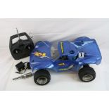 A Schumacher Nitro 21 XTR Desert Storm 1/10 remote control car together with an Acoms Transmitter