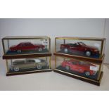 Four cased 1:18 scale diecast model classic cars to include Rolls Royce and Mercedes, models fixed