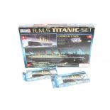 Three x Revell model kits of the R.M.S Titanic. 2 x 1:1200 scale and one 1:570 & 1:1200 scale. All