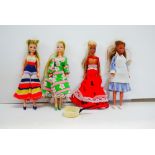 Four playworn Palitoy Pippa dolls. all appearing to have their original clothing, gd overall