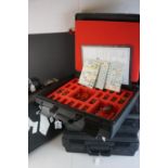 Four Games Workshop Warhammer carry cases containing a small assortment of models. Damage to hinge