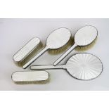 Edward VIII enamelled silver five piece dressing table set comprising hand mirror, two hand