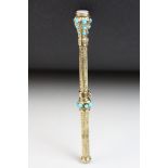 Victorian yellow metal propelling pencil, the terminal set with white chalcedony, turquoise cabochon